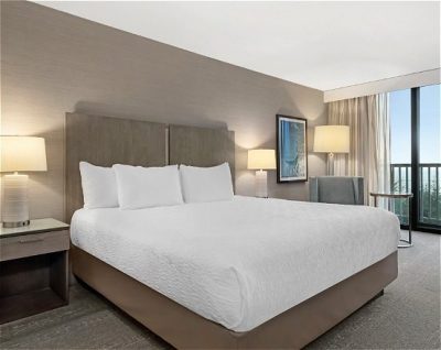 Photo of king bed and sitting area.